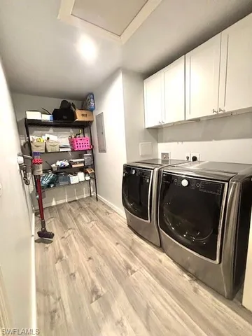 a kitchen with a sink a stove and cabinets