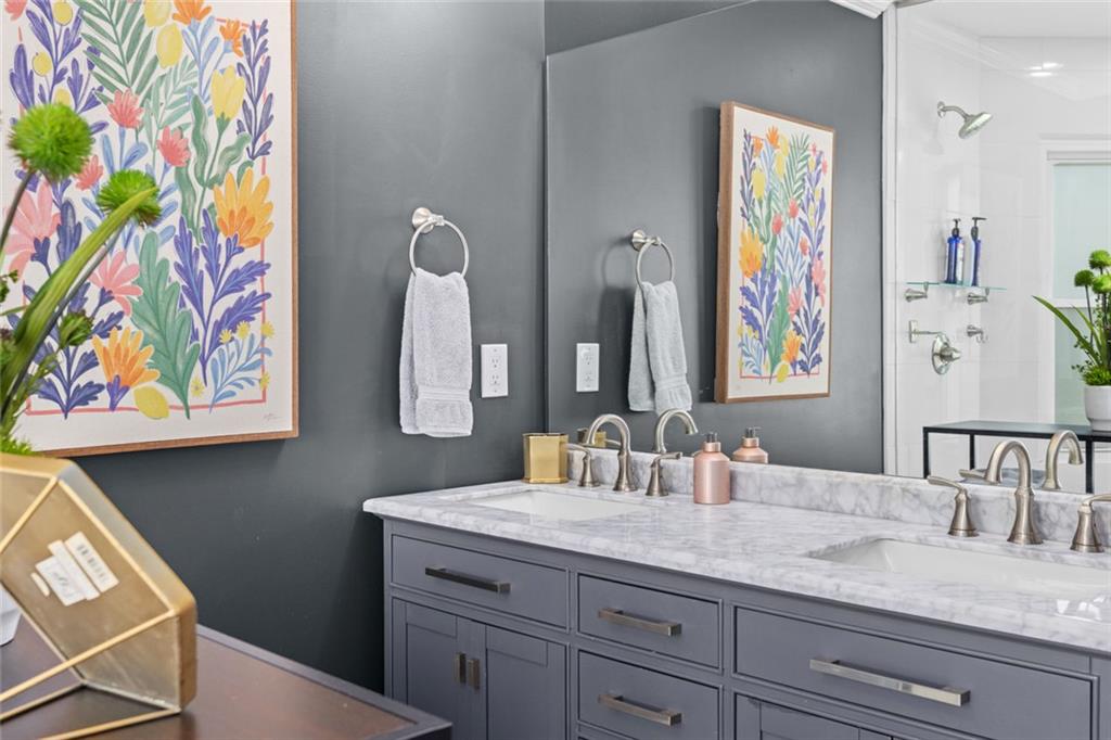 1601 Defoors Landing Northwest Atlanta, GA 30318 - Photo 30 of 48 a bathroom with a granite countertop sink a mirror and painting on the wall