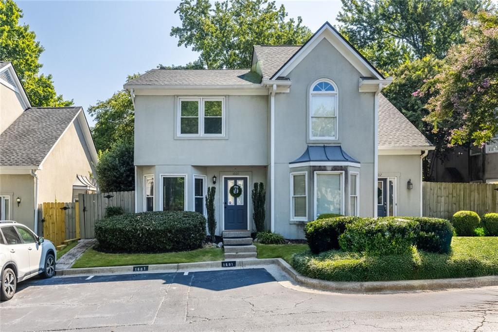 1601 Defoors Landing Northwest Atlanta, GA 30318 - Photo 3 of 48 a front view of a house with garden