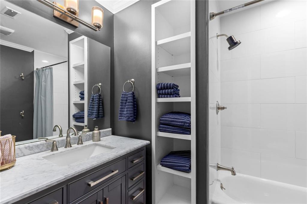 1601 Defoors Landing Northwest Atlanta, GA 30318 - Photo 39 of 48 a bathroom with a sink and a mirror