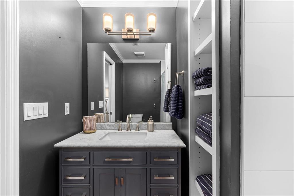 1601 Defoors Landing Northwest Atlanta, GA 30318 - Photo 41 of 48 a bathroom with a sink and a mirror