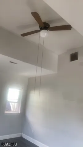 a view of a window in an empty room