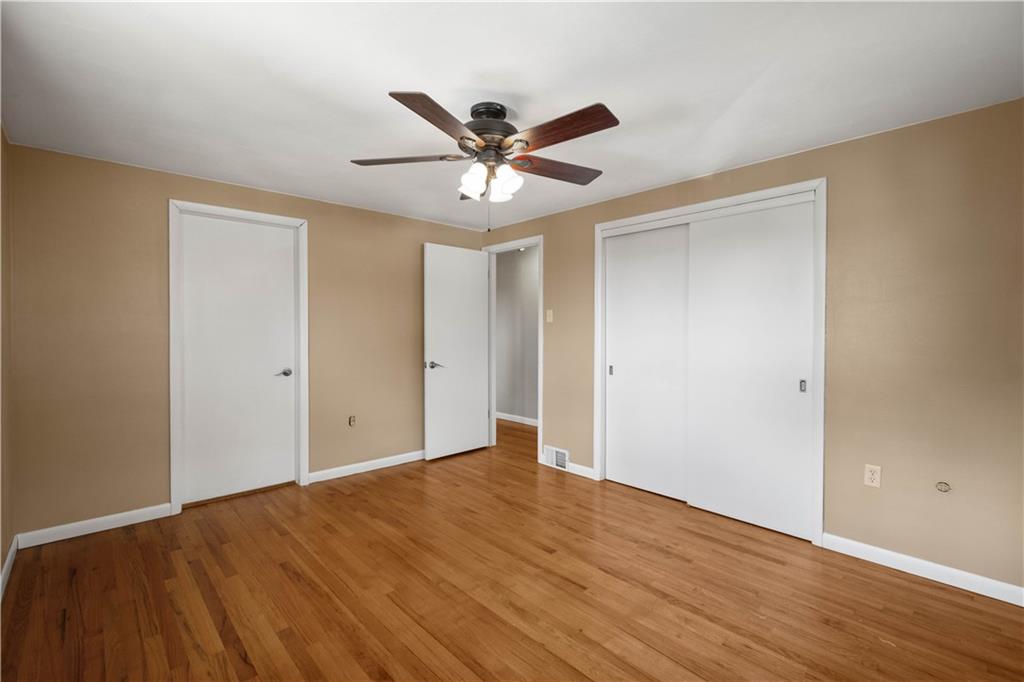 127 George Street Turtle Creek, PA 15145 - Photo 11 of 34 a view of an empty room with window and wooden floor