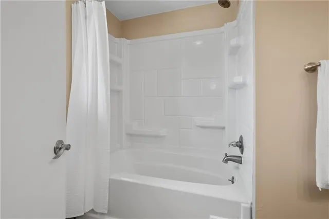 a close up of a bathtub curtain