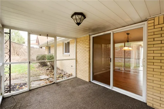a view of an empty room and window