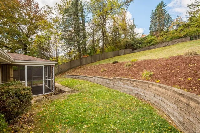 an aerial view of residential house with outdoor space and swimming pool