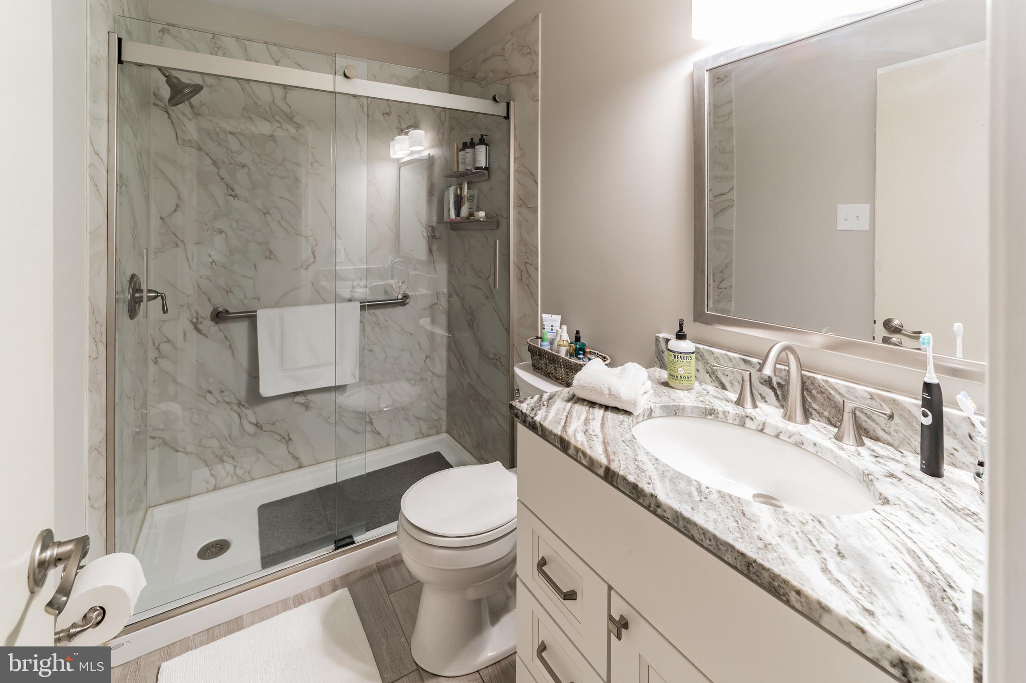 19 Ross Road Wilmington, DE 19810 - Photo 20 of 29 a bathroom with a granite countertop sink toilet and shower
