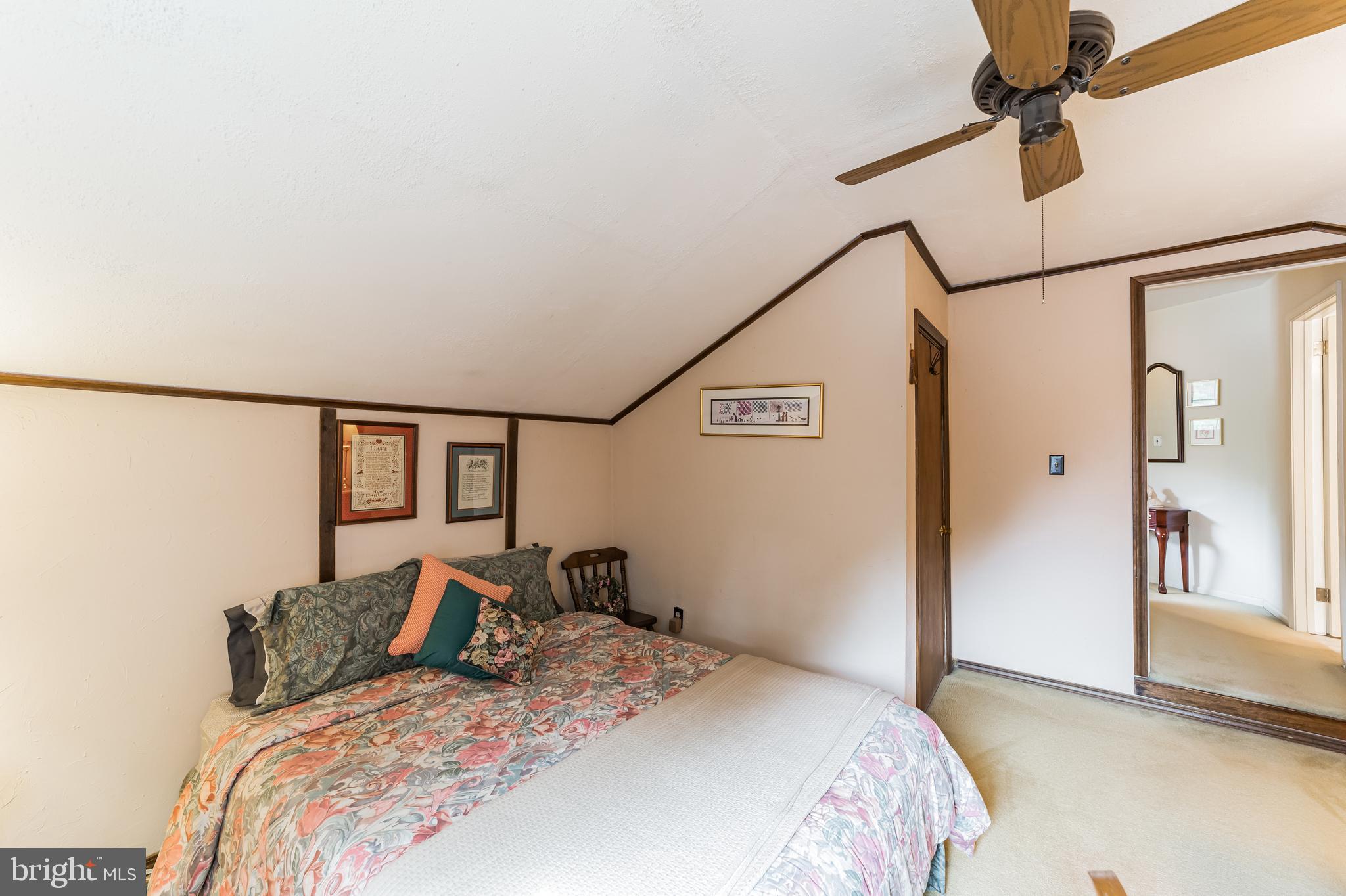19 Ross Road Wilmington, DE 19810 - Photo 22 of 29 a bedroom with a large bed and a chandelier