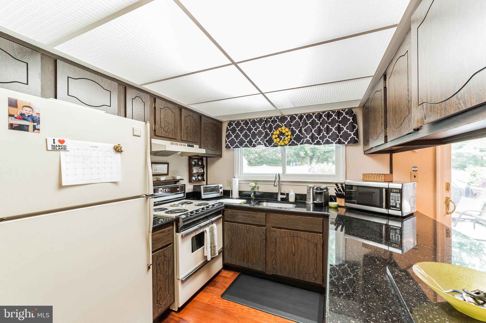 19 Ross Road Wilmington, DE 19810 - Photo 9 of 29 a kitchen with stainless steel appliances and white cabinets