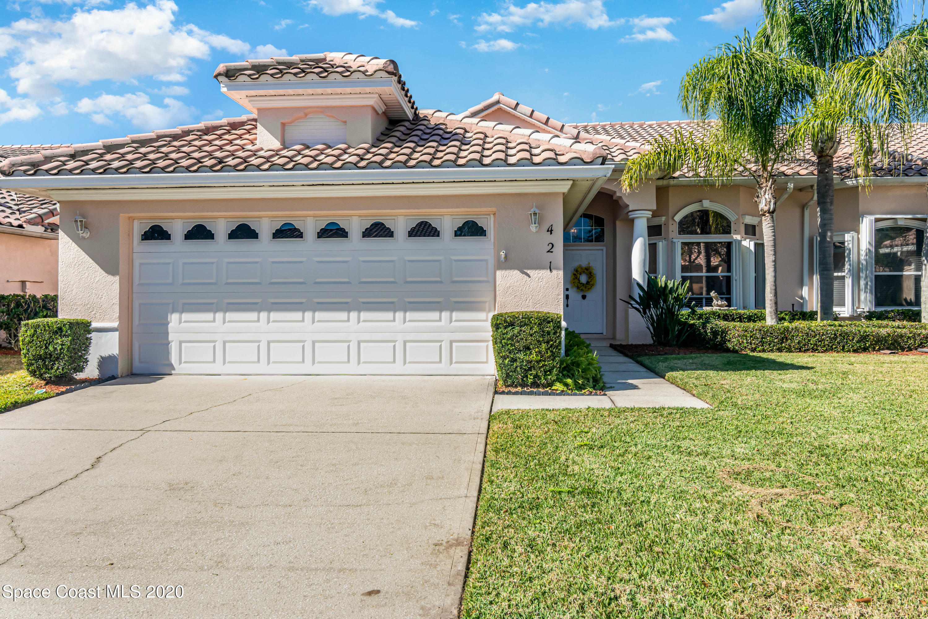 421 Shell Cove Drive Melbourne, FL 32940 - Photo 1 of 23 front view of a house with a yard