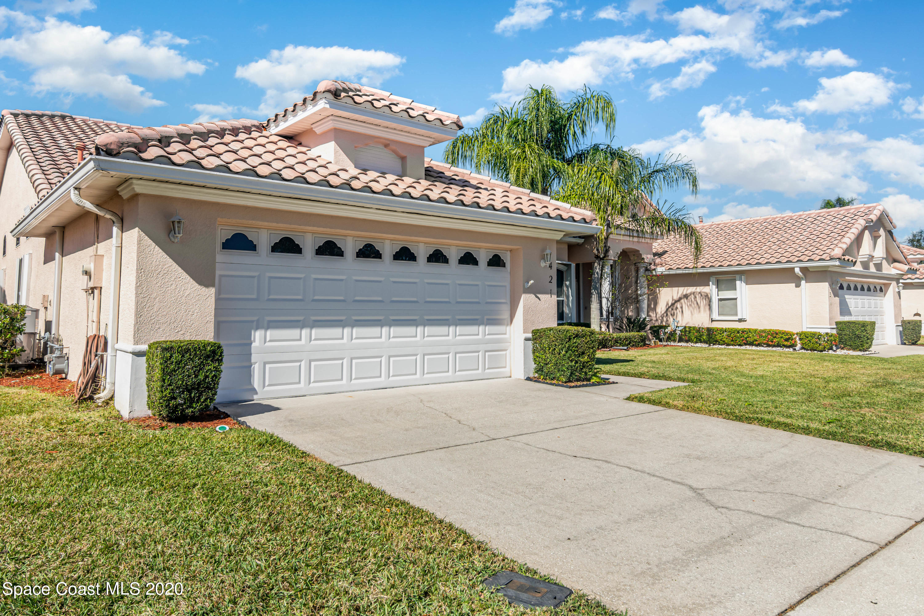421 Shell Cove Drive Melbourne, FL 32940 - Photo 2 of 23 front view of a house with a yard