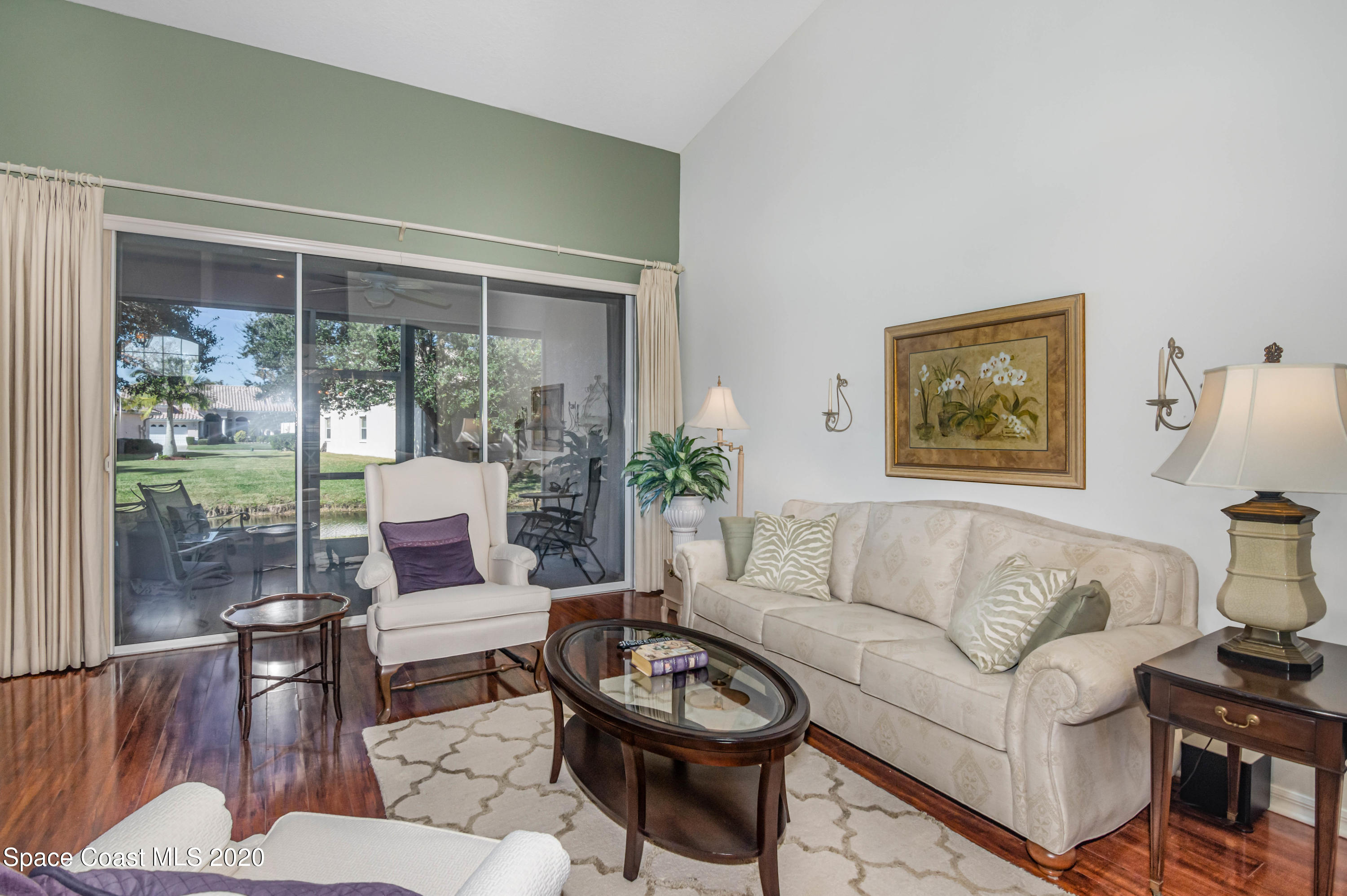 421 Shell Cove Drive Melbourne, FL 32940 - Photo 13 of 23 a living room with furniture and a large window