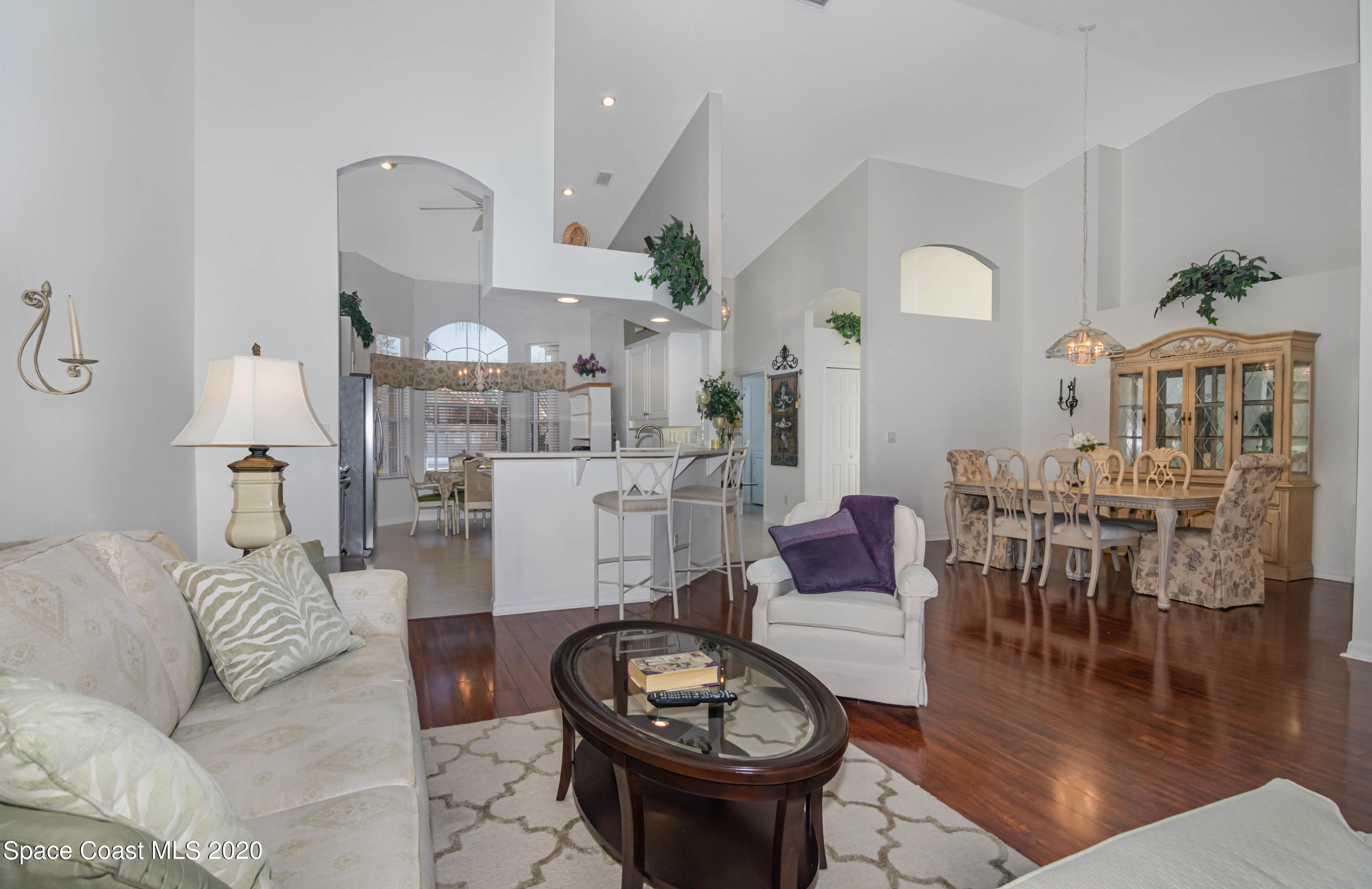 421 Shell Cove Drive Melbourne, FL 32940 - Photo 15 of 23 a living room with furniture and a dining table