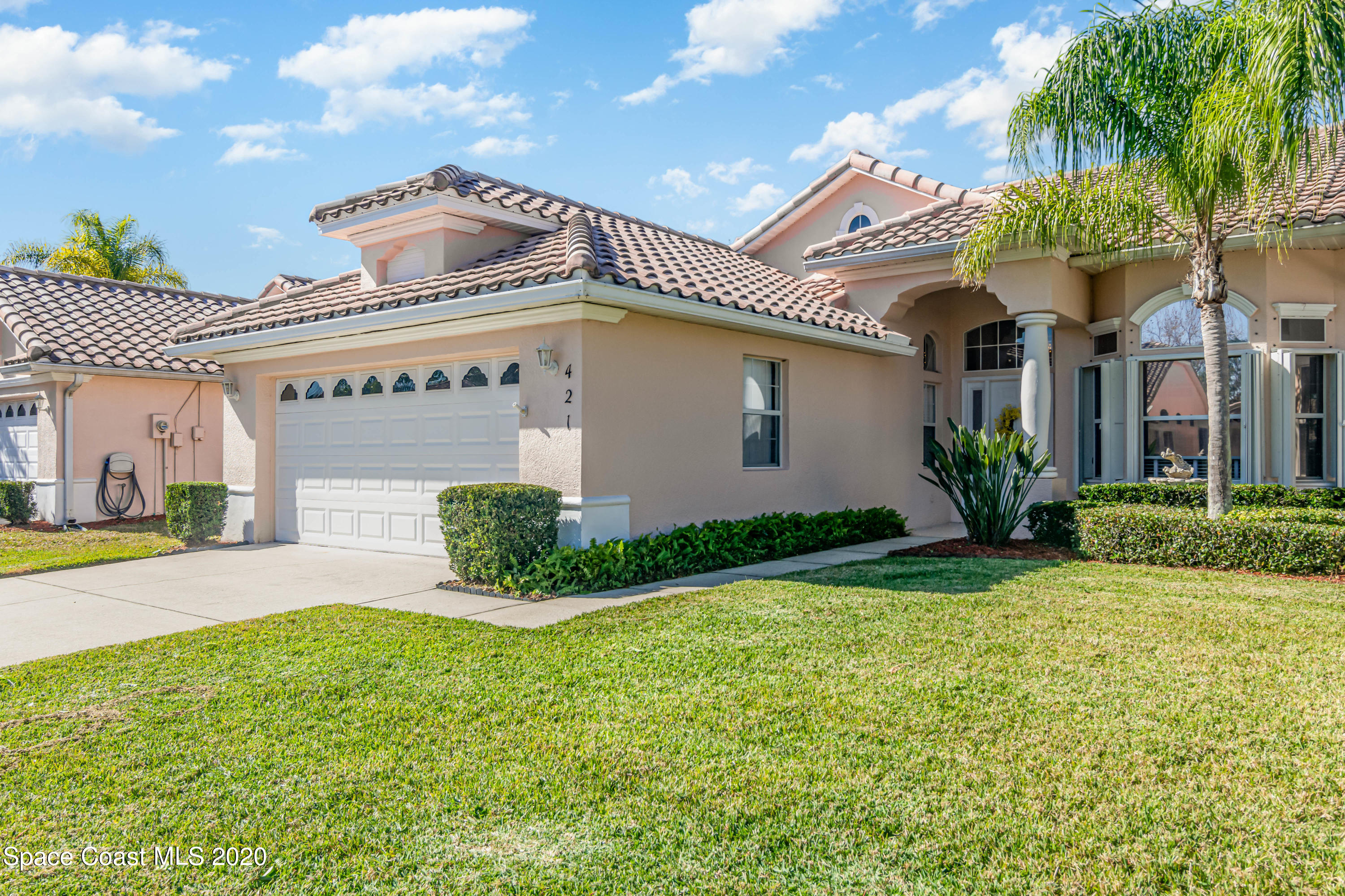 421 Shell Cove Drive Melbourne, FL 32940 - Photo 3 of 23 a front view of a house with garden