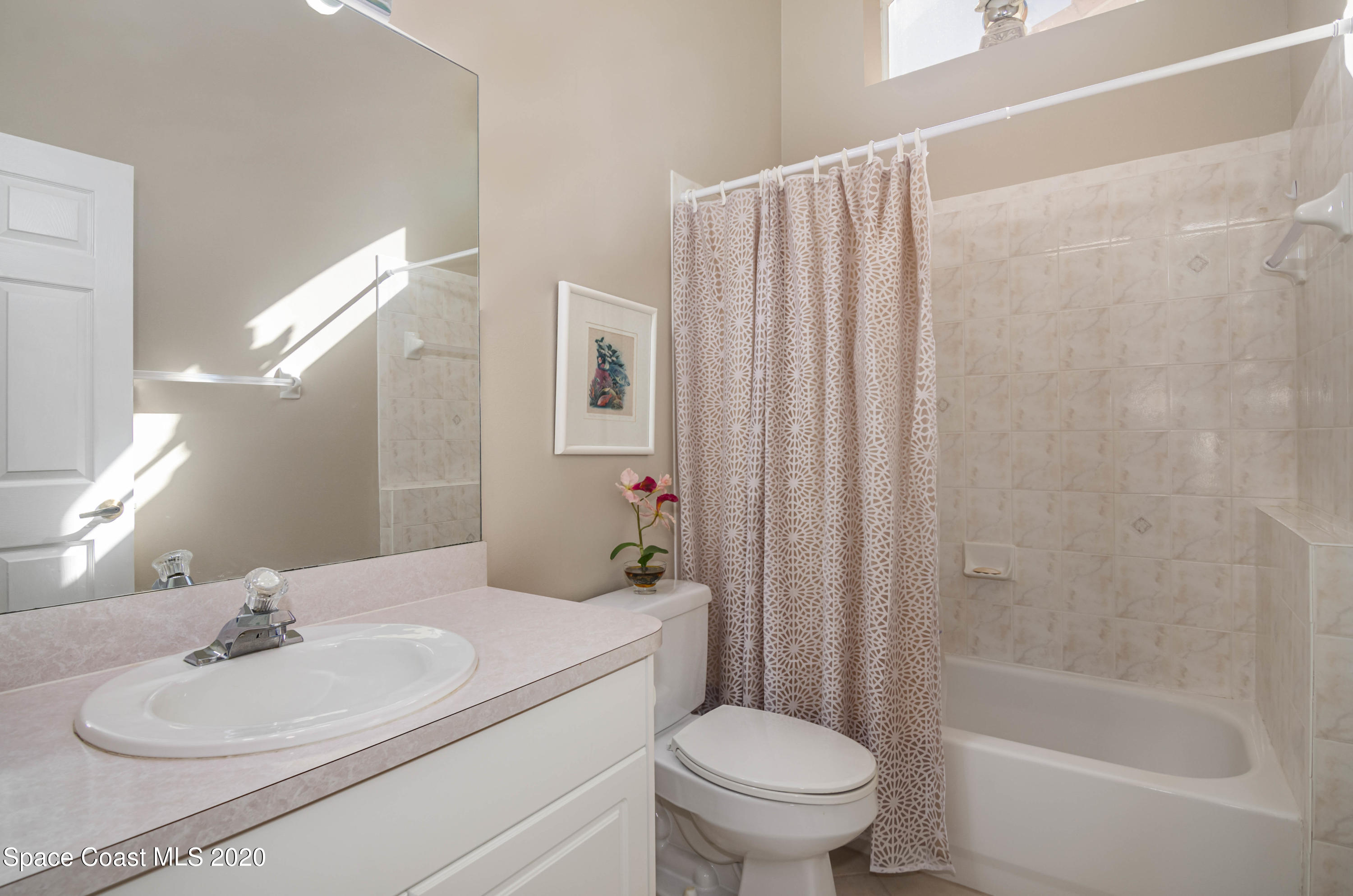 421 Shell Cove Drive Melbourne, FL 32940 - Photo 21 of 23 a bathroom with a sink toilet and shower
