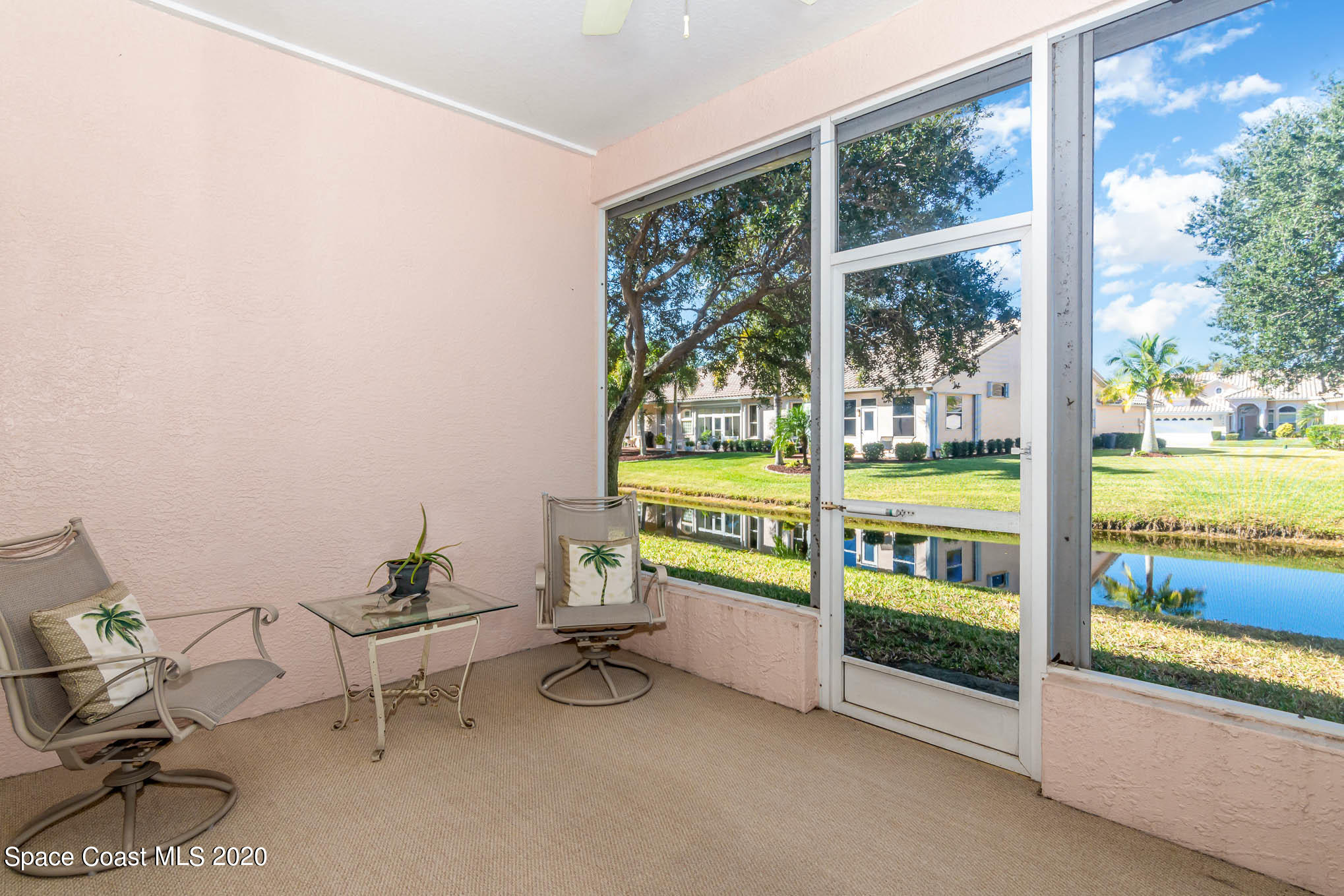 421 Shell Cove Drive Melbourne, FL 32940 - Photo 6 of 23 a reading room with furniture and a floor to ceiling window