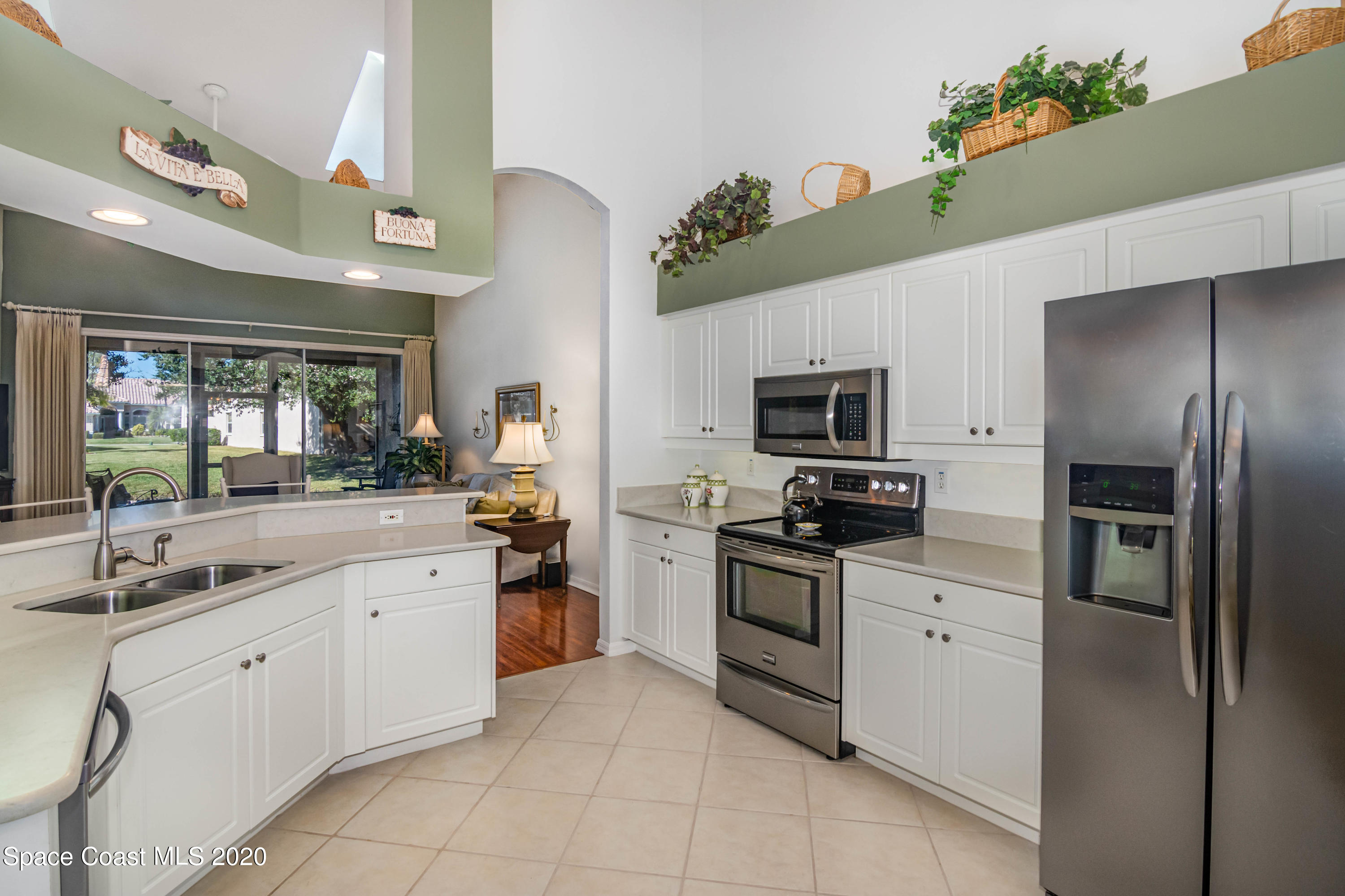 421 Shell Cove Drive Melbourne, FL 32940 - Photo 8 of 23 a kitchen with cabinets stainless steel appliances and a counter top space