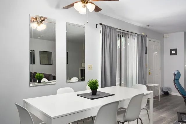 a dining room with furniture and window