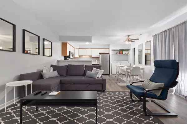 a living room with furniture and a rug