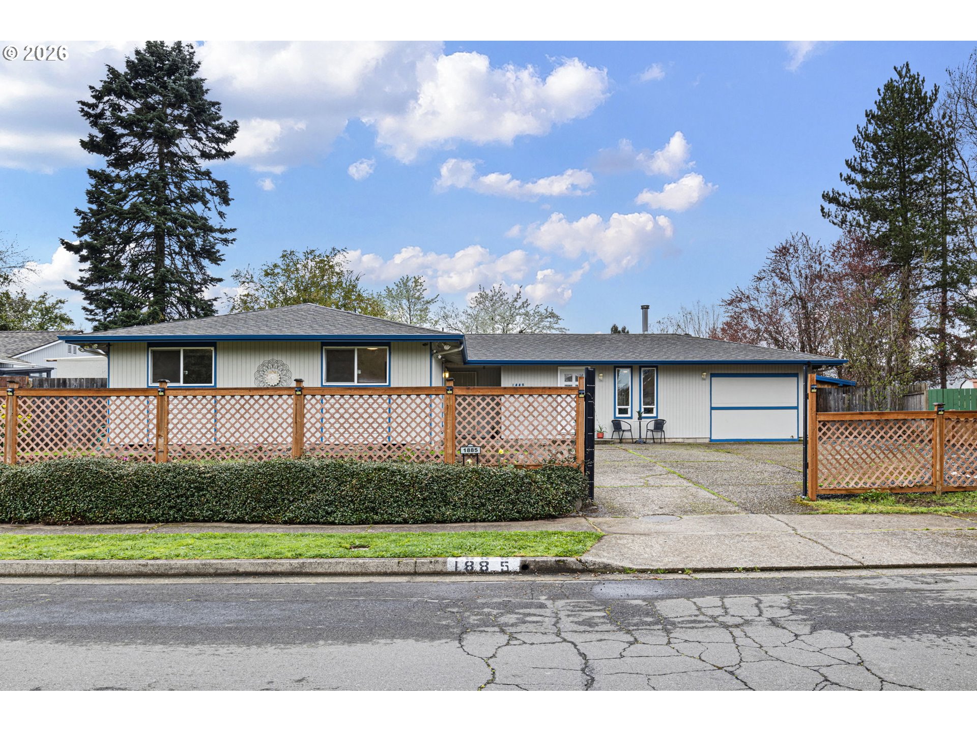 1885 Churchill Street Eugene, OR 97405 - Photo 1 of 45 a view front of house with a yard and potted plants