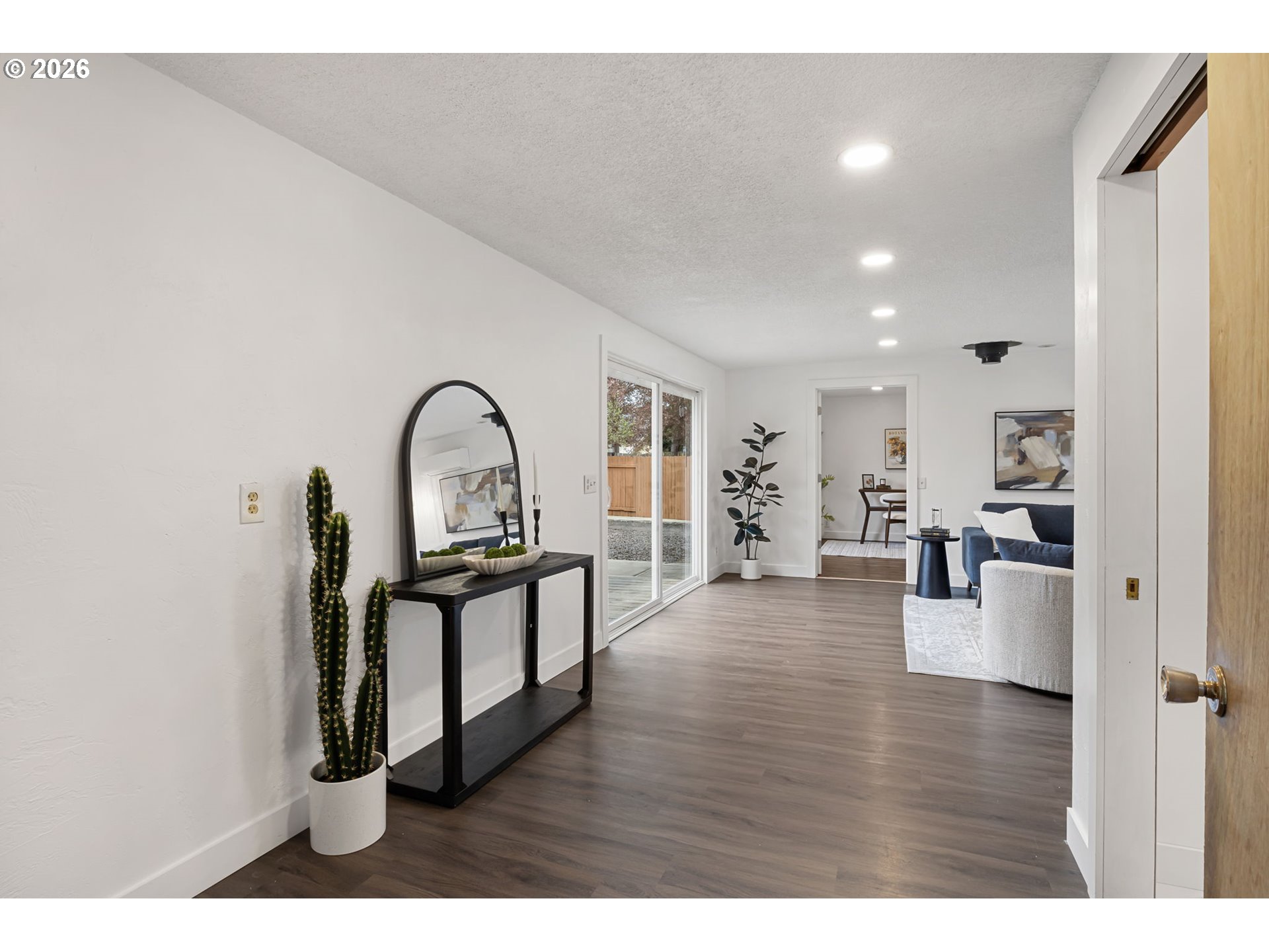 1885 Churchill Street Eugene, OR 97405 - Photo 11 of 45 a view of living room and kitchen with furniture and wooden floor
