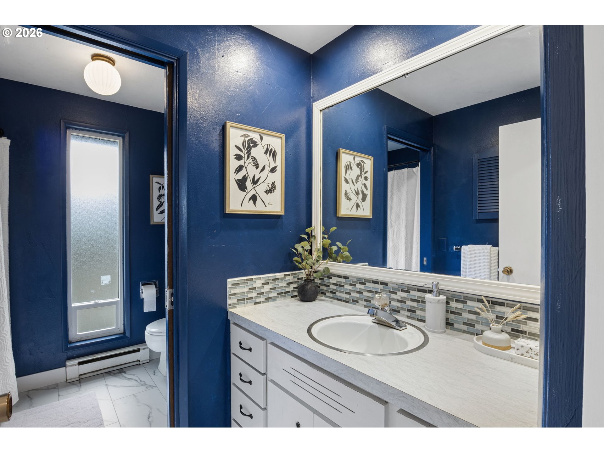 1885 Churchill Street Eugene, OR 97405 - Photo 23 of 45 a bathroom with a sink and a mirror