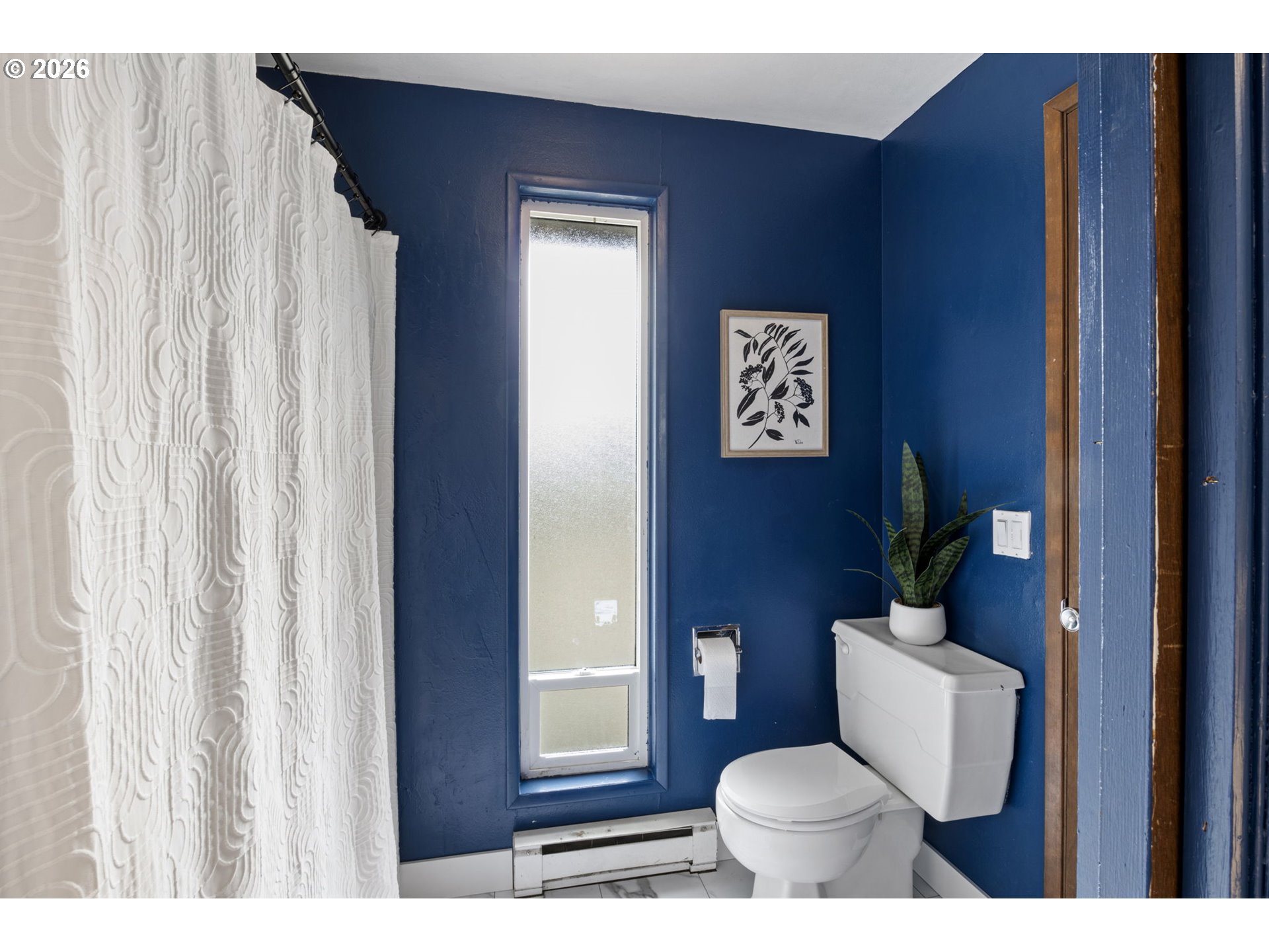 1885 Churchill Street Eugene, OR 97405 - Photo 24 of 45 a bathroom with a toilet and a painting