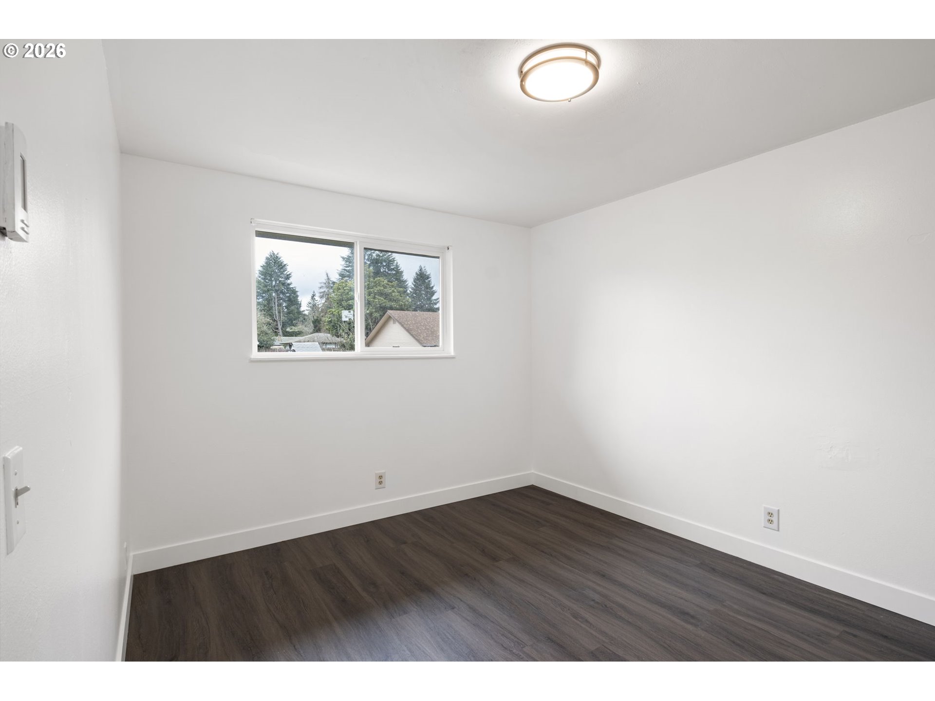 1885 Churchill Street Eugene, OR 97405 - Photo 25 of 45 a view of room with wooden floor and window