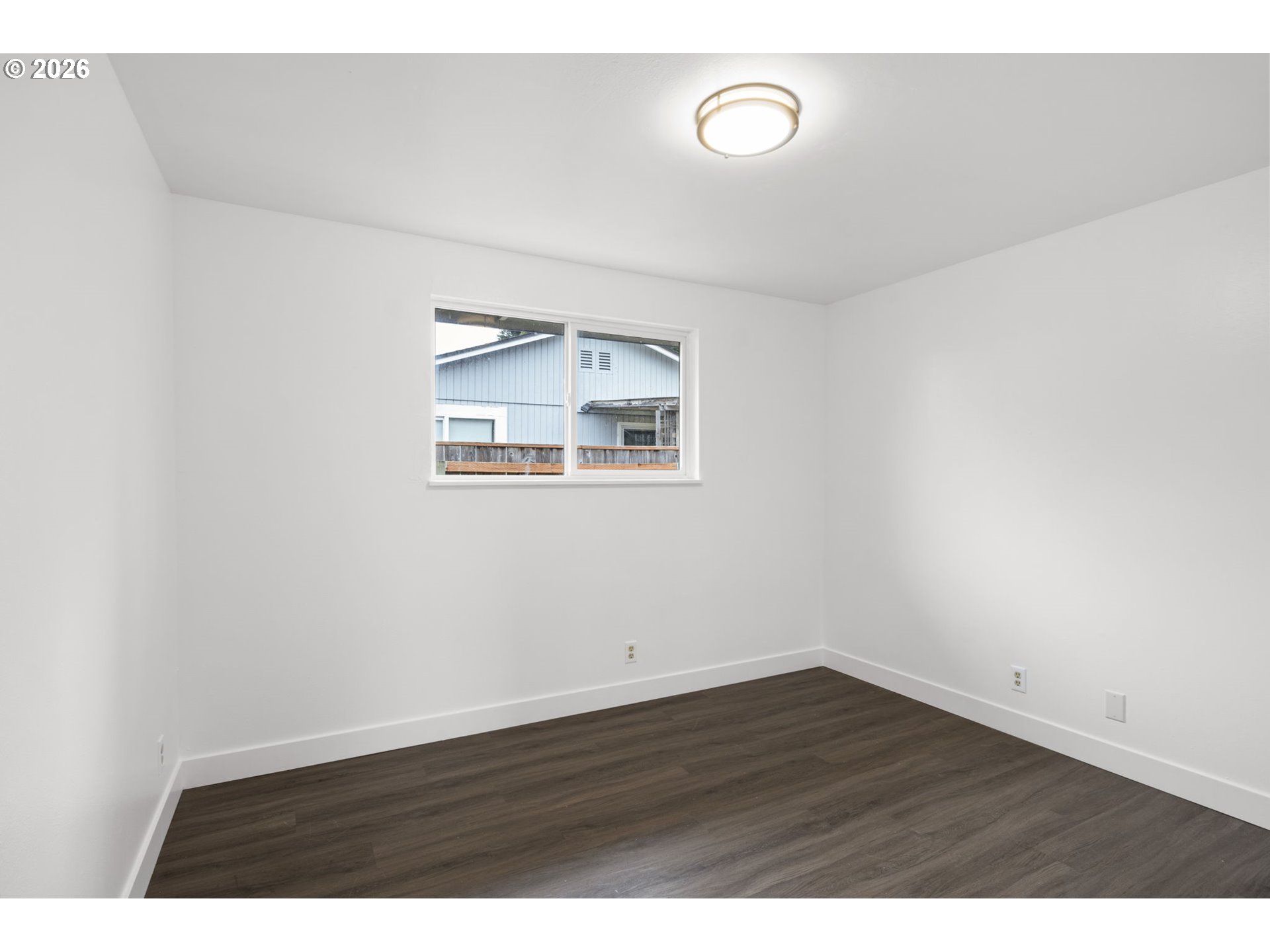 1885 Churchill Street Eugene, OR 97405 - Photo 27 of 45 a view of an empty room with wooden floor