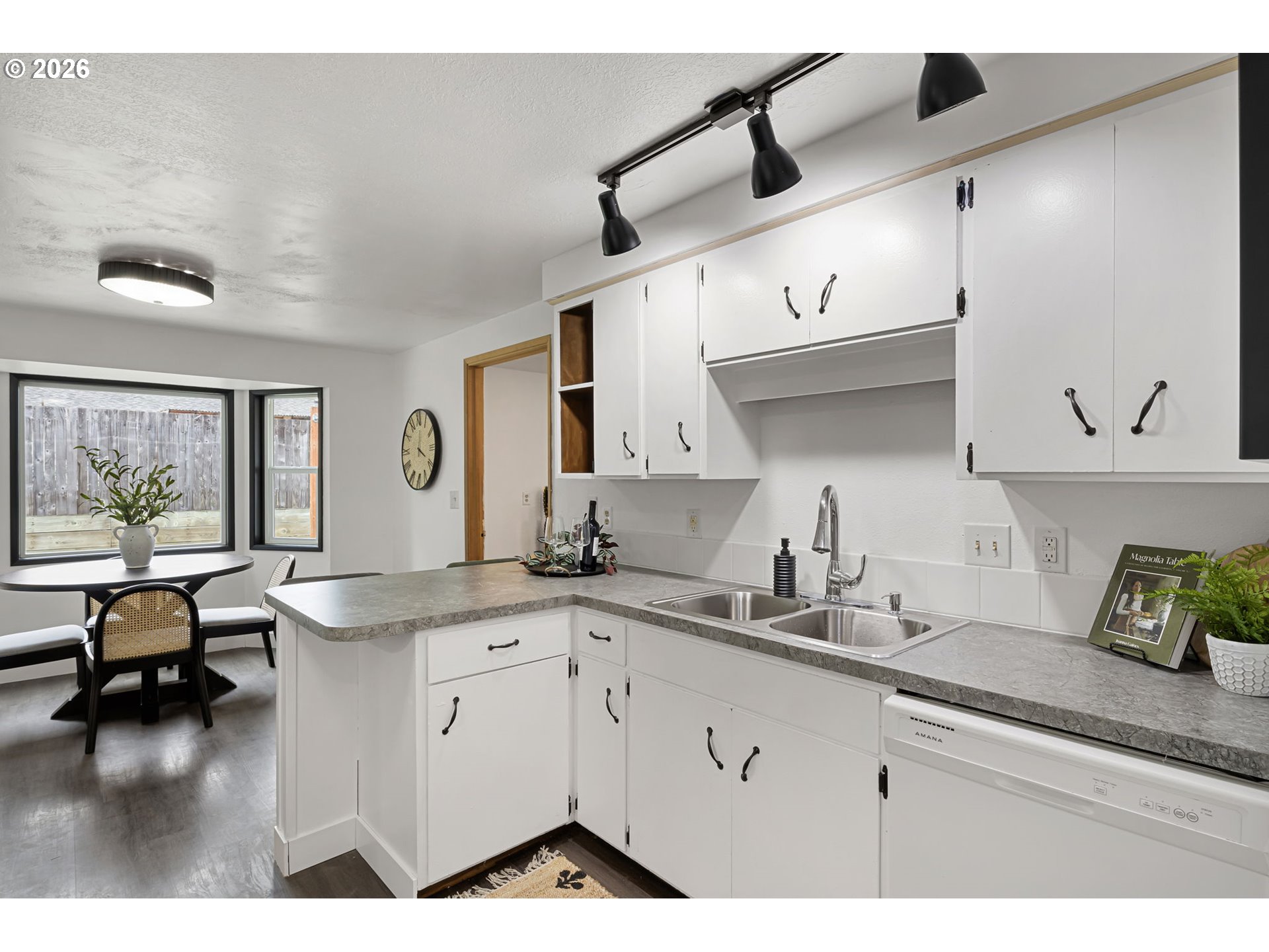1885 Churchill Street Eugene, OR 97405 - Photo 8 of 45 a kitchen with a sink dishwasher and white cabinets