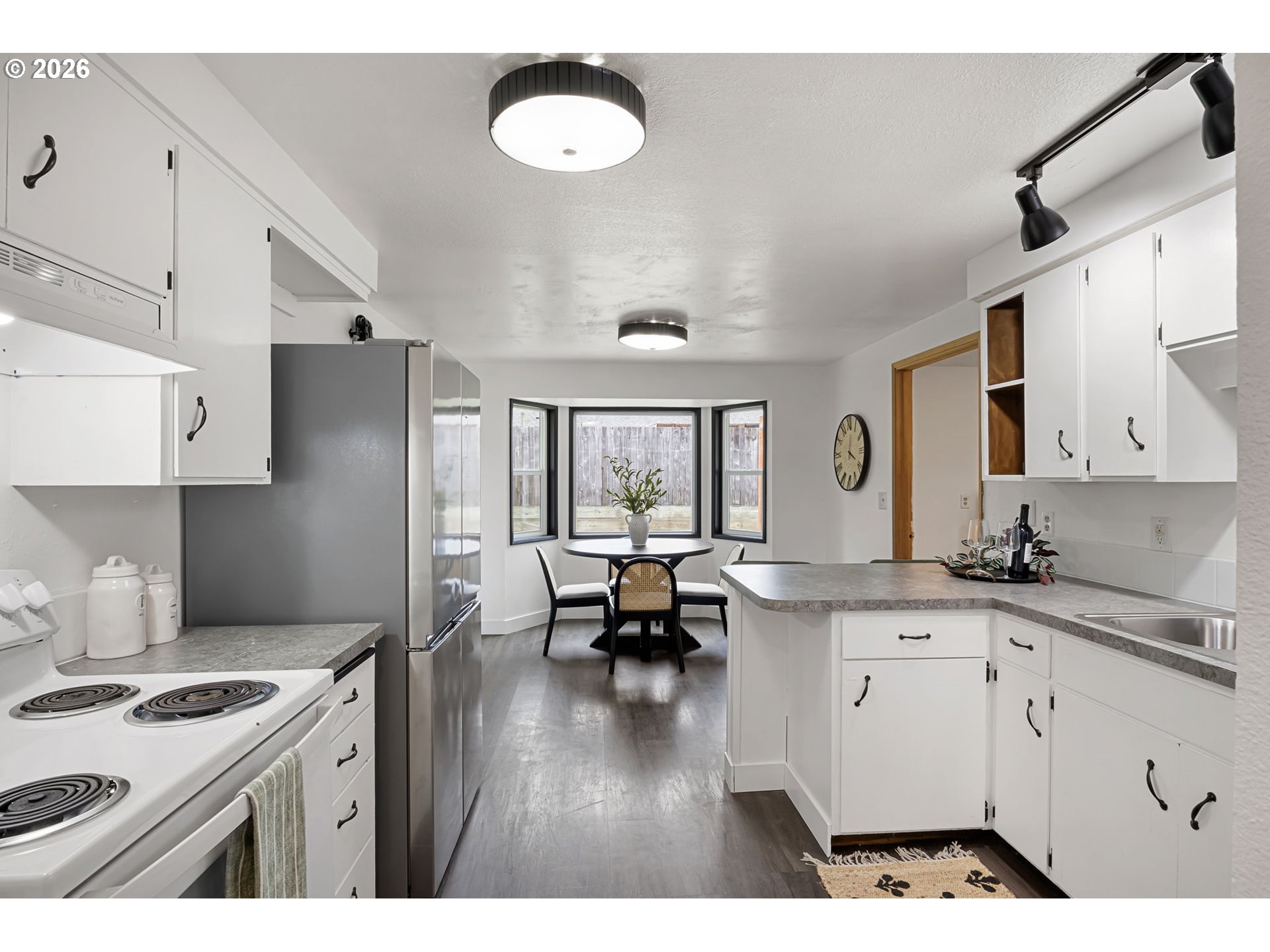 1885 Churchill Street Eugene, OR 97405 - Photo 10 of 45 a kitchen with granite countertop a sink stove and refrigerator