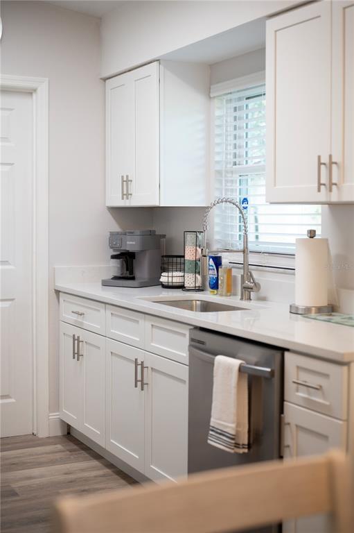 1106 Lakewood Road Lakeland, FL 33805 - Photo 13 of 27 a kitchen with cabinets appliances a sink and a window