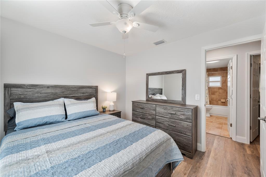 1106 Lakewood Road Lakeland, FL 33805 - Photo 21 of 27 a bedroom with a bed and a dresser