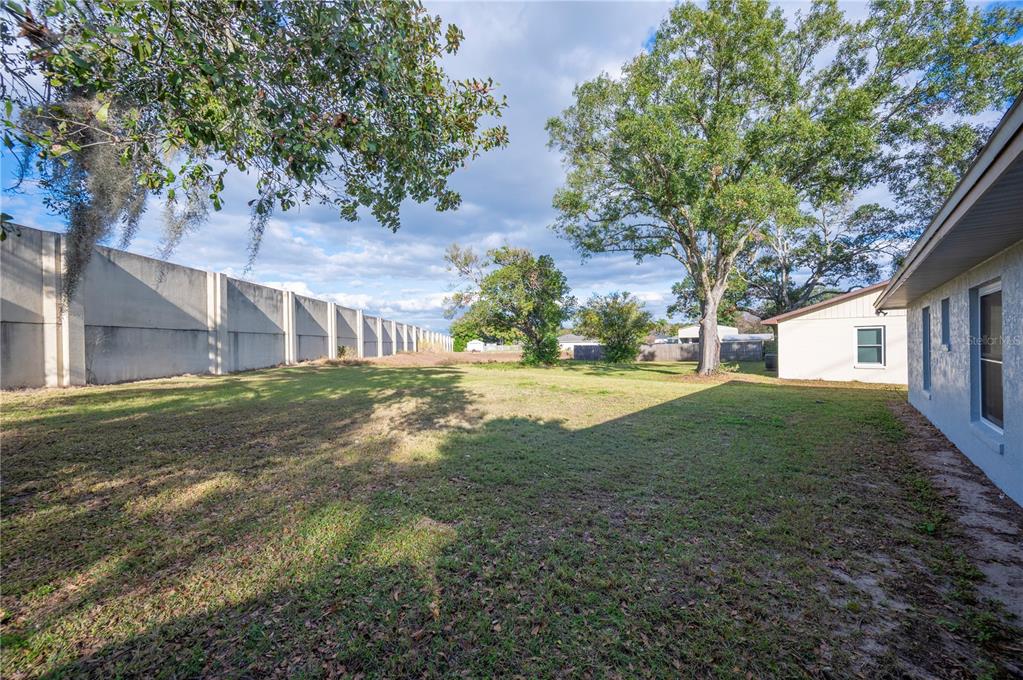 1106 Lakewood Road Lakeland, FL 33805 - Photo 26 of 27 a view of a house with a yard
