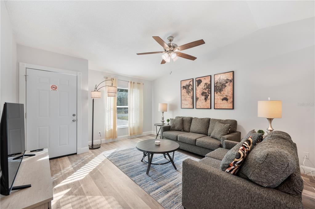 1106 Lakewood Road Lakeland, FL 33805 - Photo 3 of 27 a living room with furniture and a window