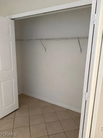 a view of an empty walk in closet