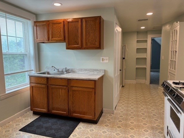 36 School Street, Unit 3 Woburn, MA 01801 - Photo 5 of 8 a bathroom with a sink and a mirror