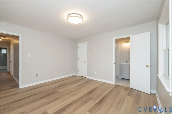 a view of room with wooden floor