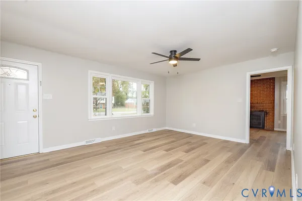 a view of an empty room with a window