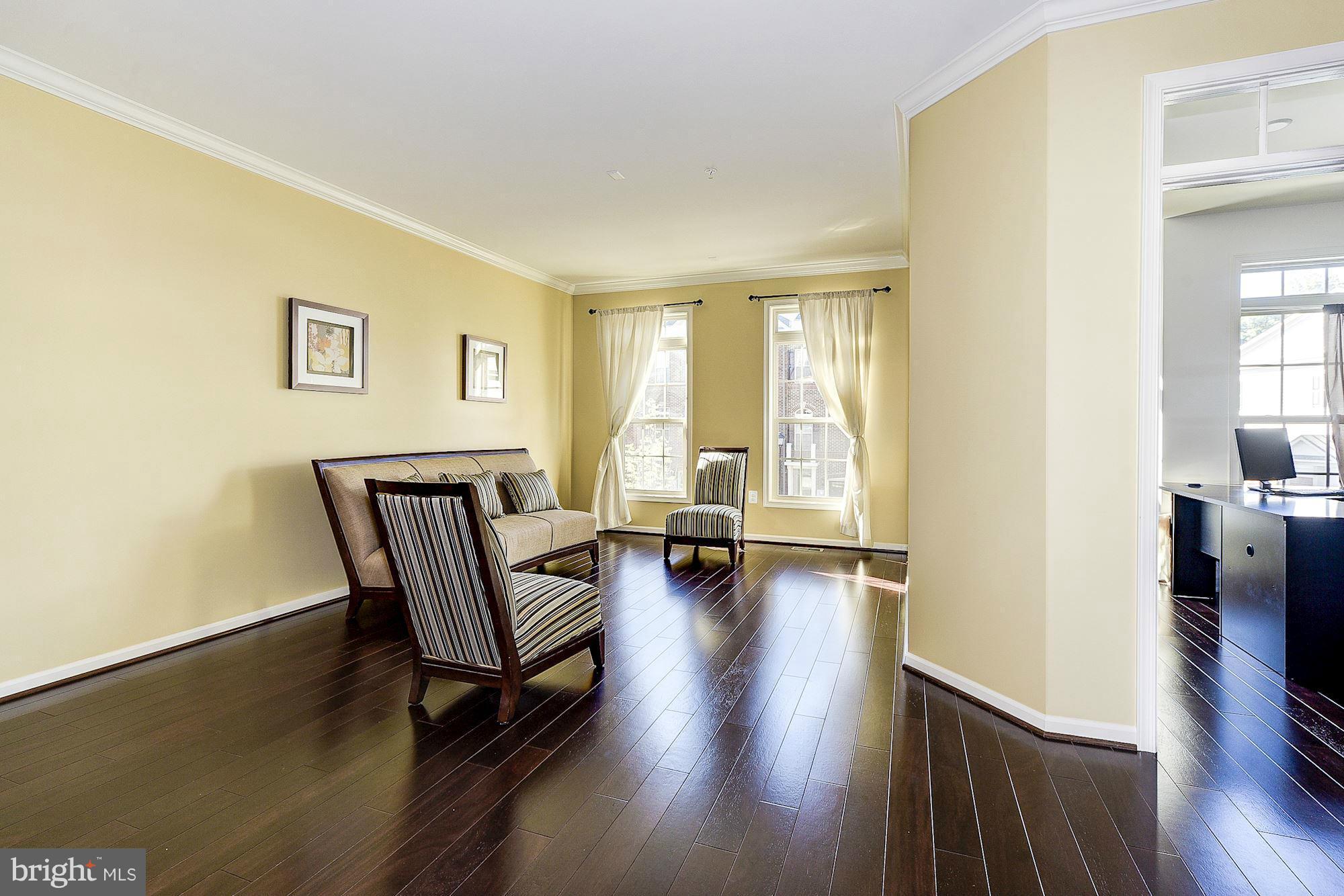 1525 Rabbit Hollow Place Silver Spring, MD 20906 - Photo 2 of 30 a view of a livingroom with furniture and wooden floor