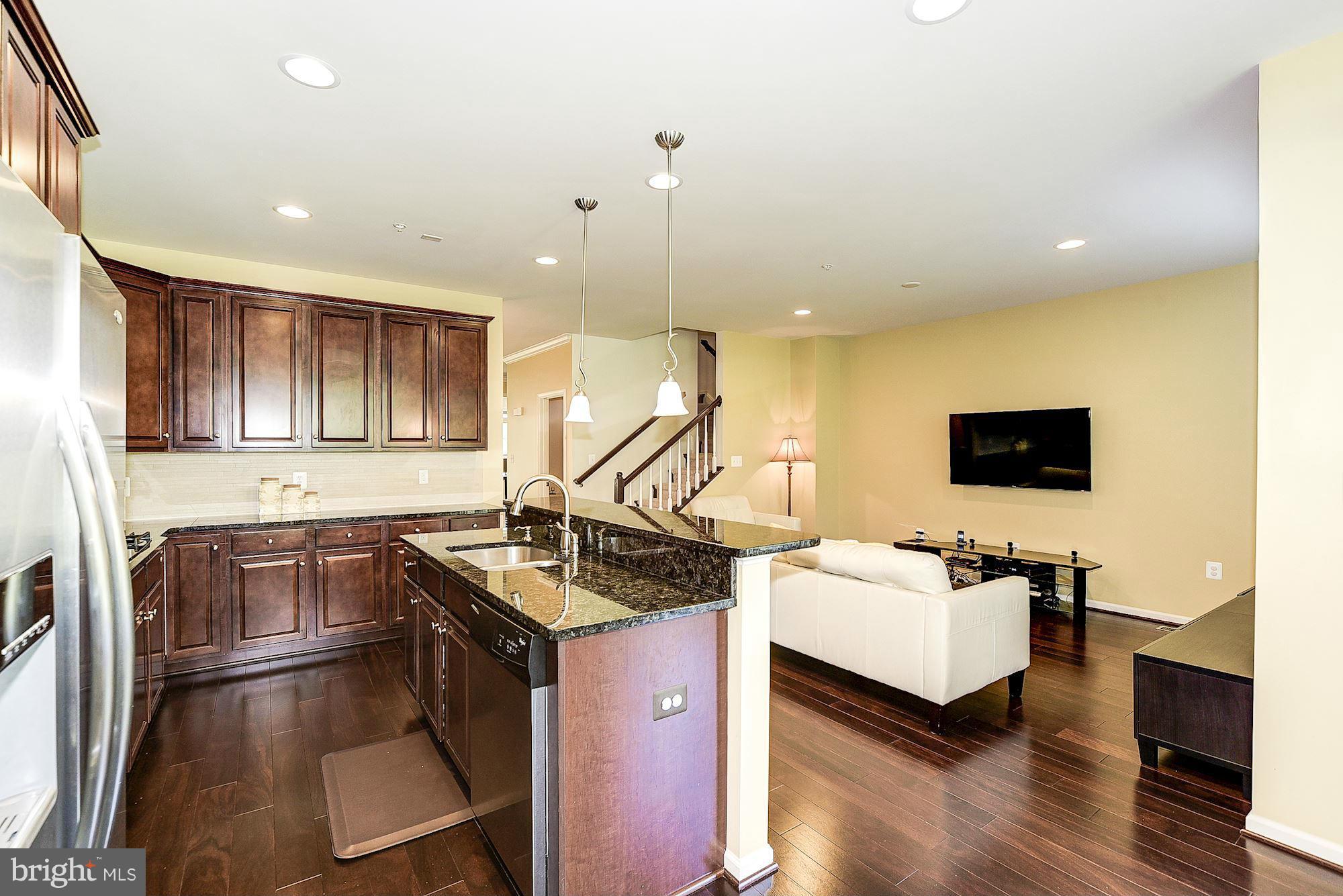 1525 Rabbit Hollow Place Silver Spring, MD 20906 - Photo 11 of 30 a kitchen that has a sink and a stove in it