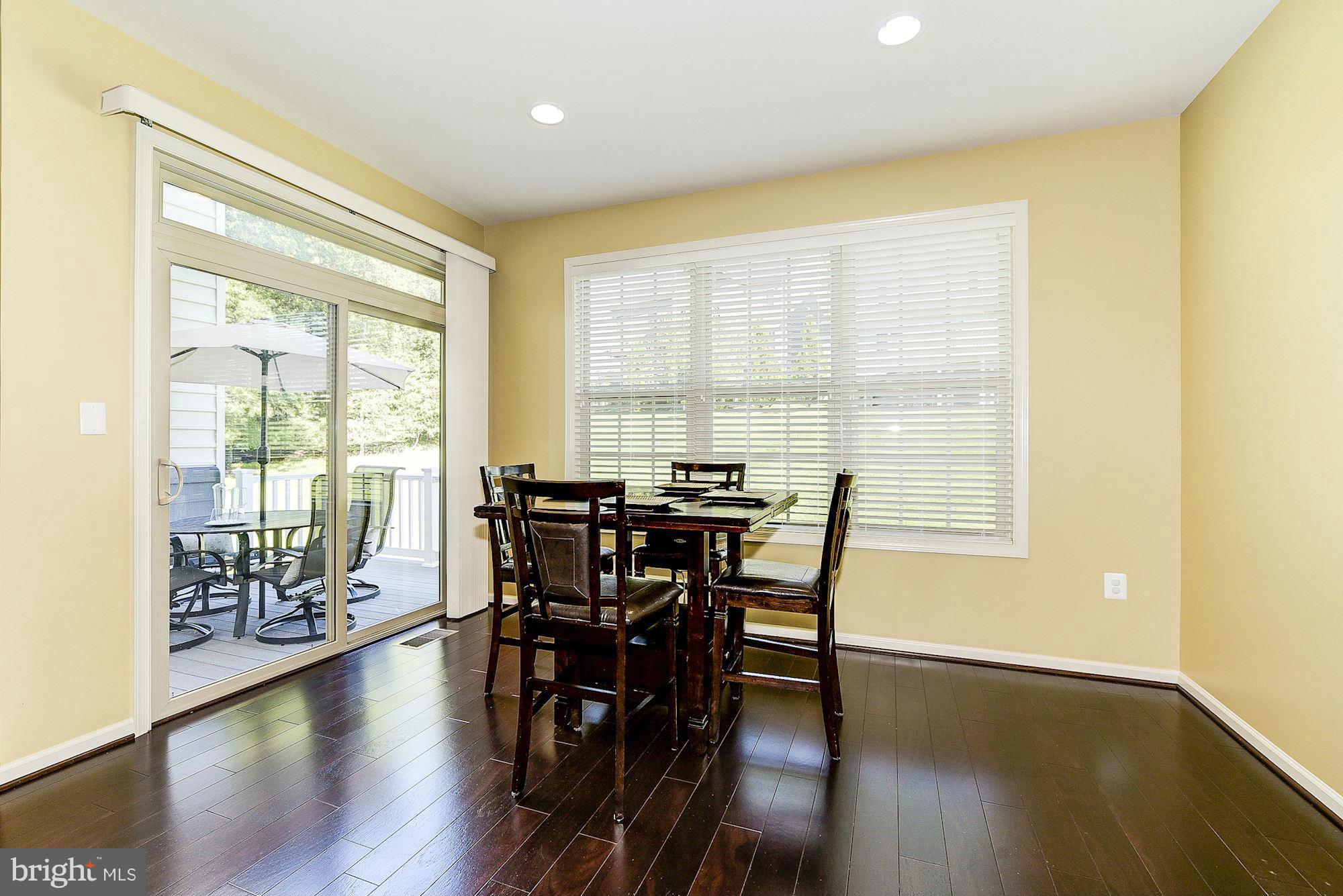1525 Rabbit Hollow Place Silver Spring, MD 20906 - Photo 13 of 30 a view of a dining room with furniture and wooden floor