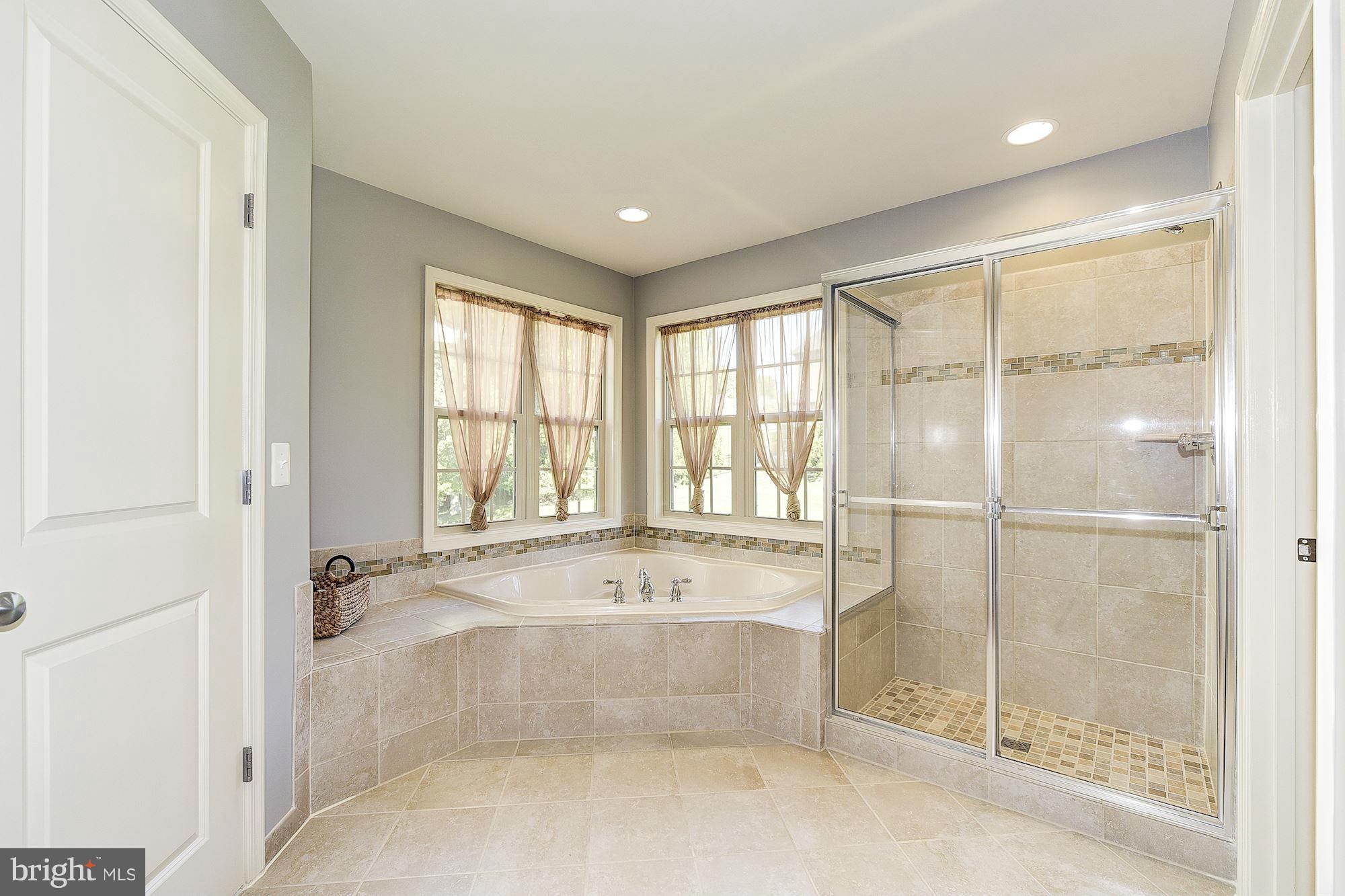 1525 Rabbit Hollow Place Silver Spring, MD 20906 - Photo 17 of 30 a spacious bathroom with a tub and shower