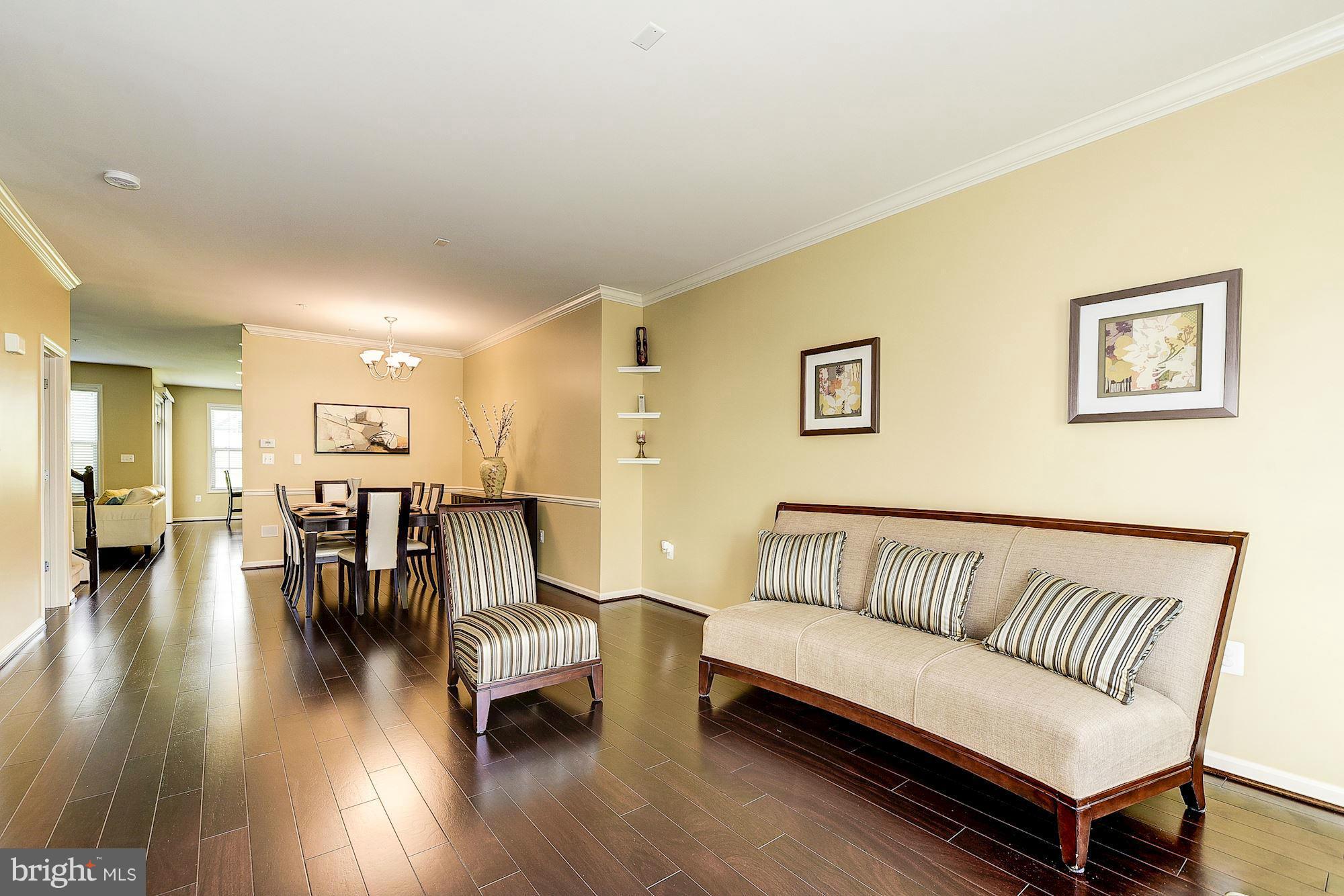 1525 Rabbit Hollow Place Silver Spring, MD 20906 - Photo 3 of 30 a living room with furniture and a wooden floor