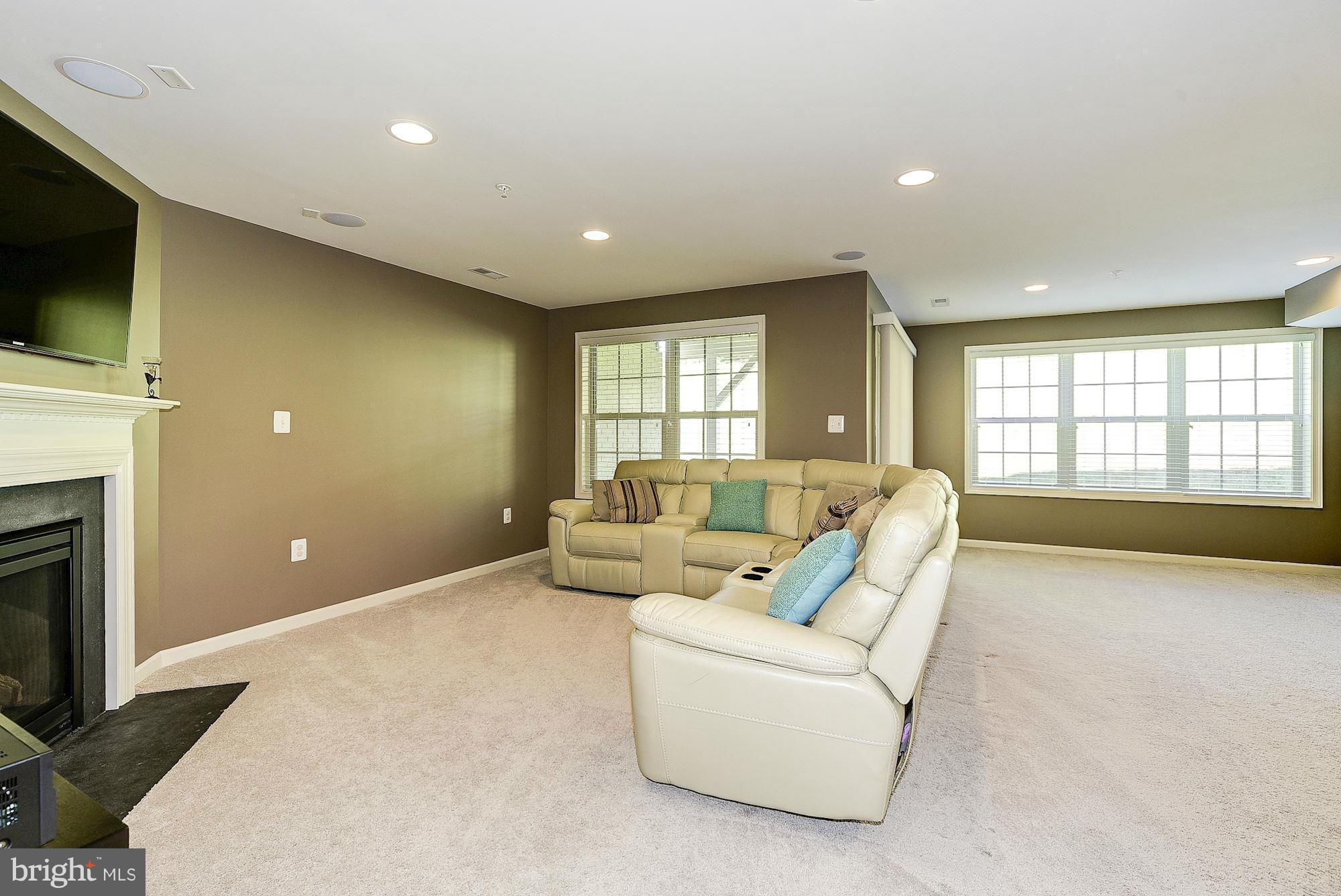 1525 Rabbit Hollow Place Silver Spring, MD 20906 - Photo 22 of 30 a living room with furniture and a flat screen tv