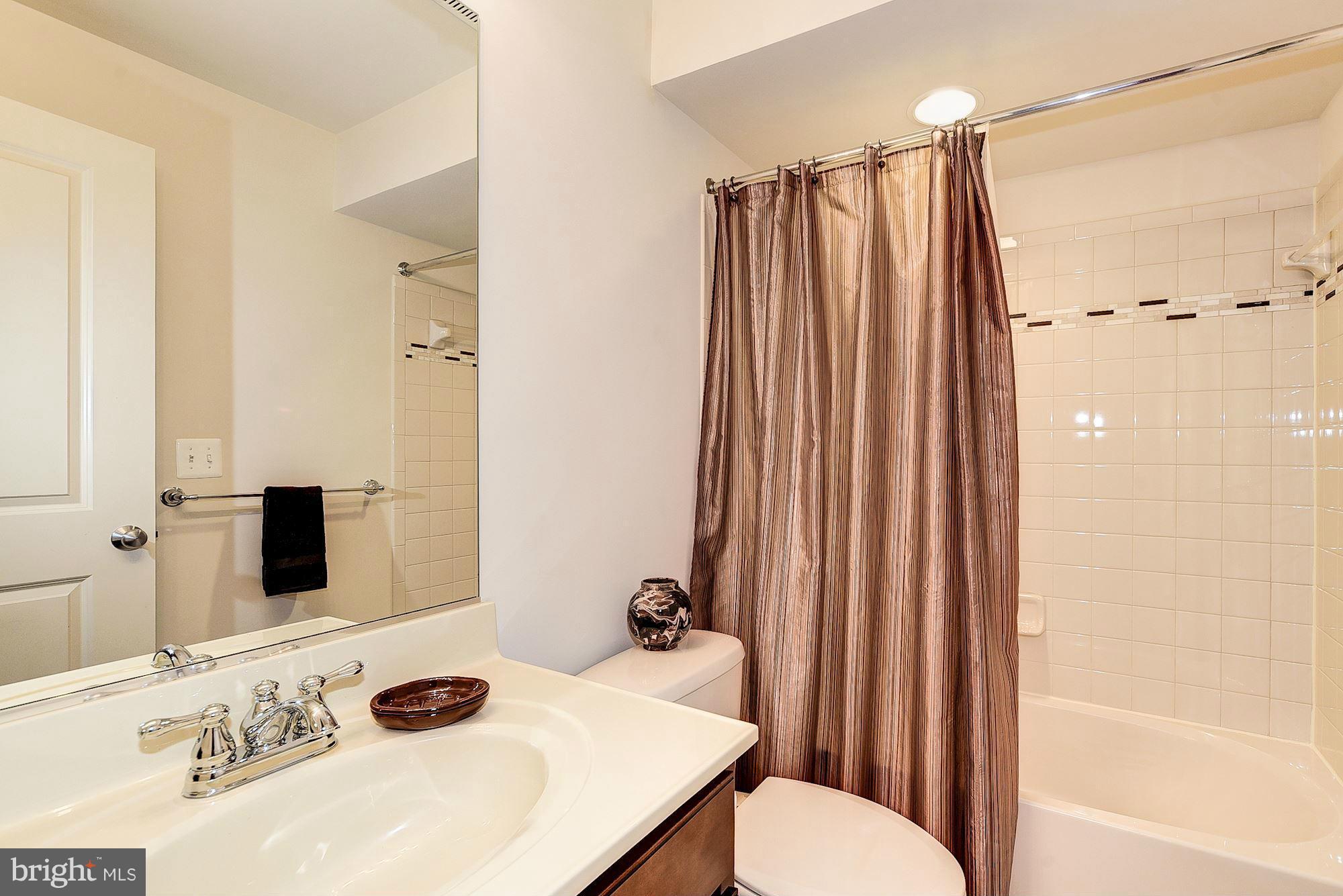 1525 Rabbit Hollow Place Silver Spring, MD 20906 - Photo 24 of 30 a bathroom with a sink toilet and shower