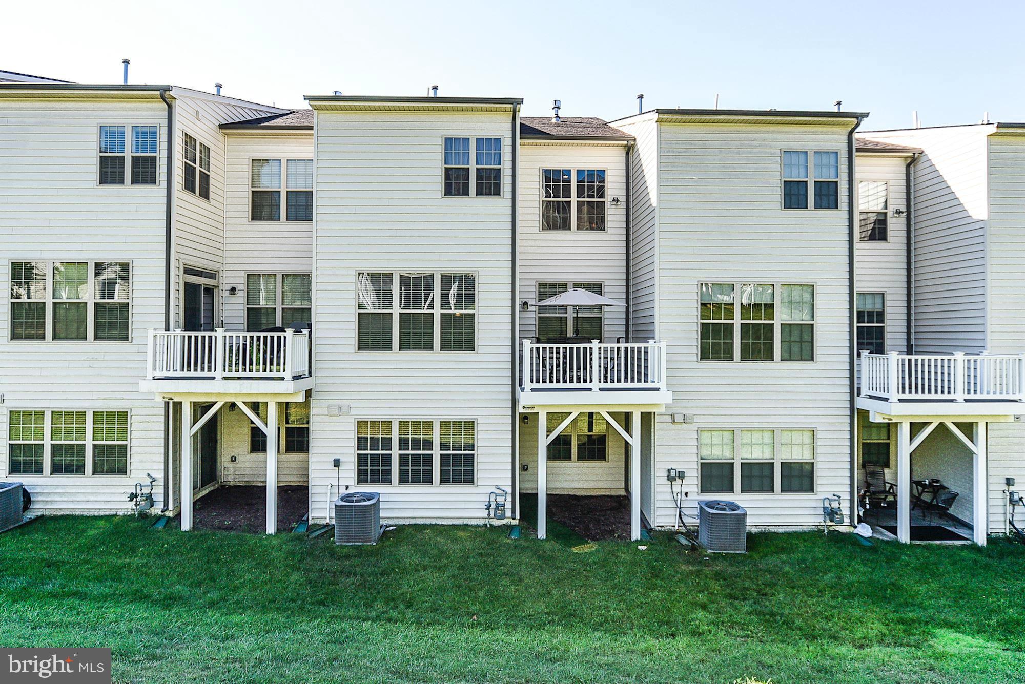 1525 Rabbit Hollow Place Silver Spring, MD 20906 - Photo 26 of 30 a large building with a garden