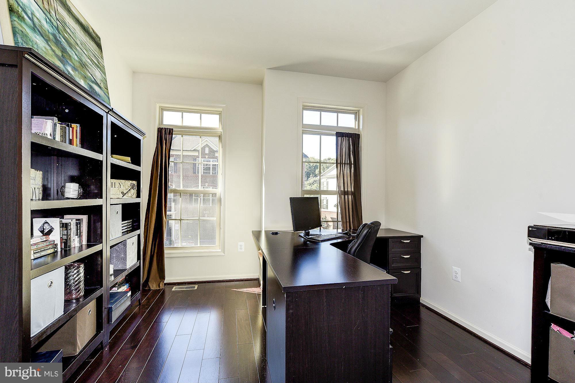 1525 Rabbit Hollow Place Silver Spring, MD 20906 - Photo 4 of 30 a view of a workspace with furniture and wooden floor