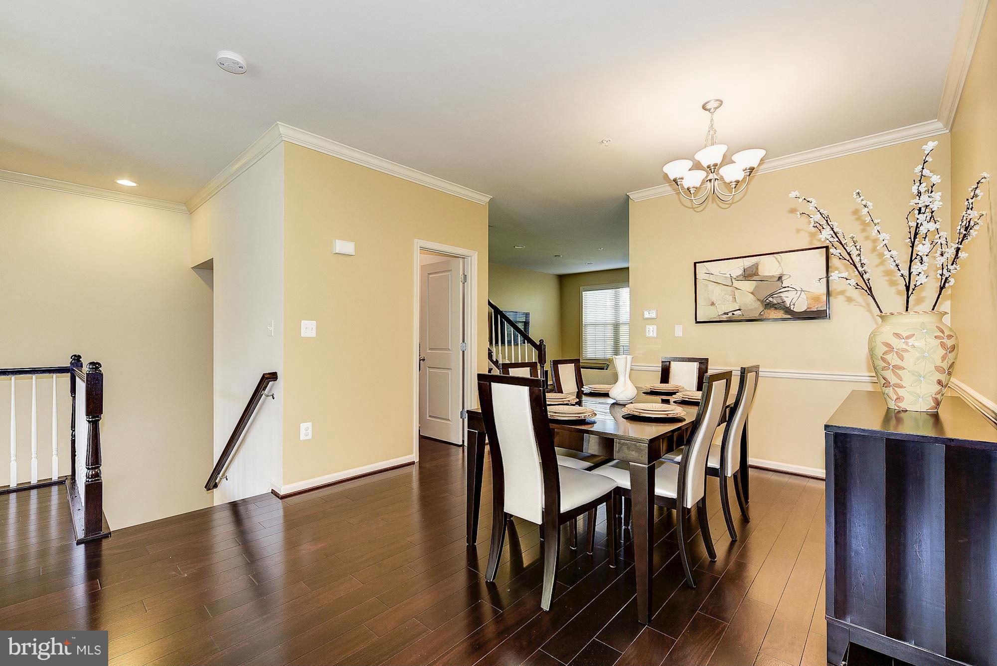1525 Rabbit Hollow Place Silver Spring, MD 20906 - Photo 5 of 30 a view of a dining room with furniture and wooden floor