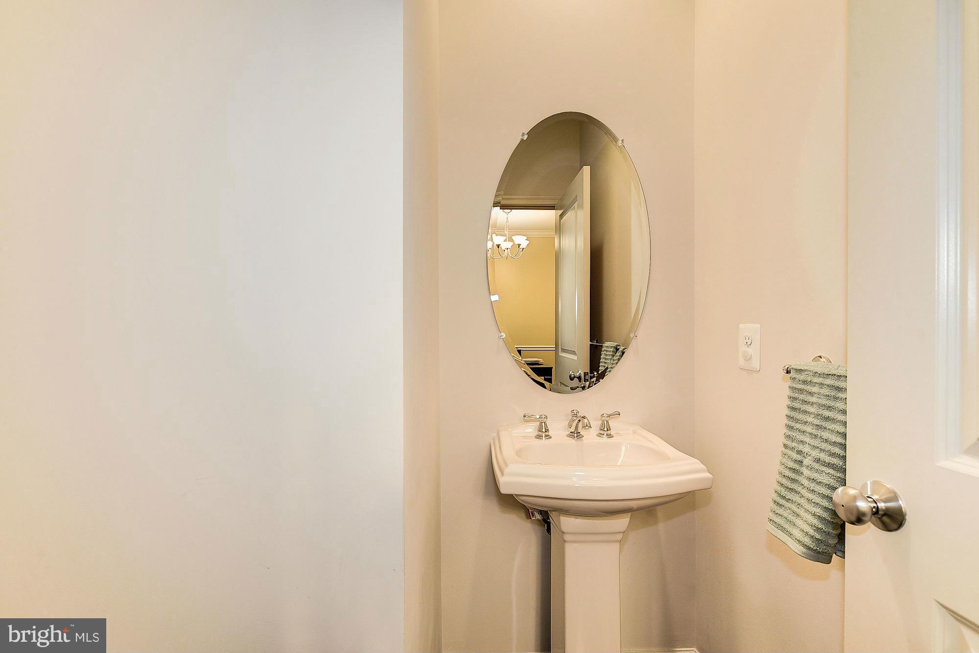 1525 Rabbit Hollow Place Silver Spring, MD 20906 - Photo 6 of 30 a bathroom with a sink and a mirror
